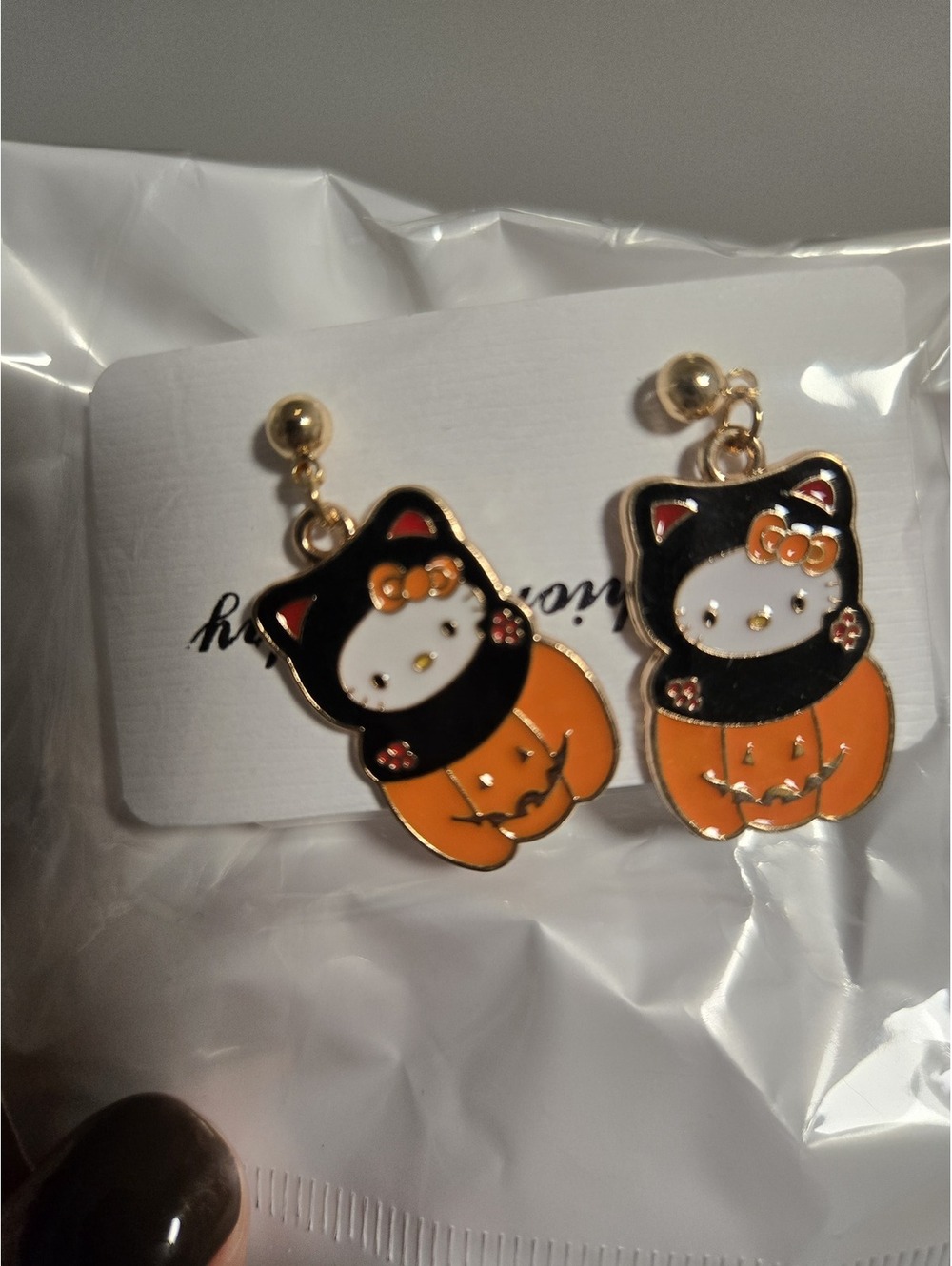 Hello Kitty Halloween enamel earrings orange black